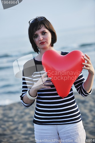 Image of young woman relax  on beach