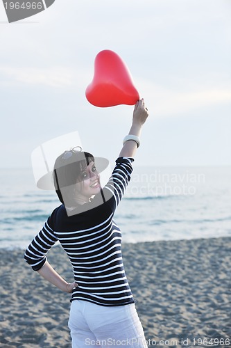 Image of young woman relax  on beach