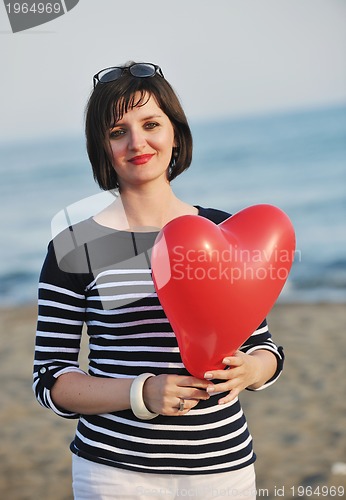 Image of young woman relax  on beach