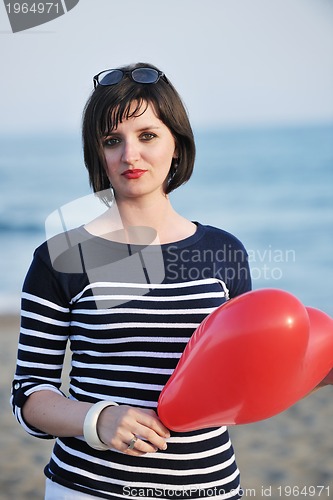 Image of young woman relax  on beach