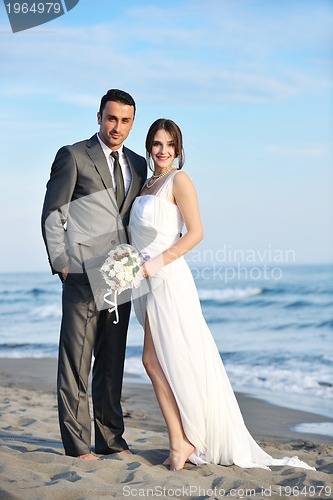 Image of romantic beach wedding at sunset