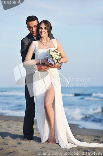 Image of romantic beach wedding at sunset