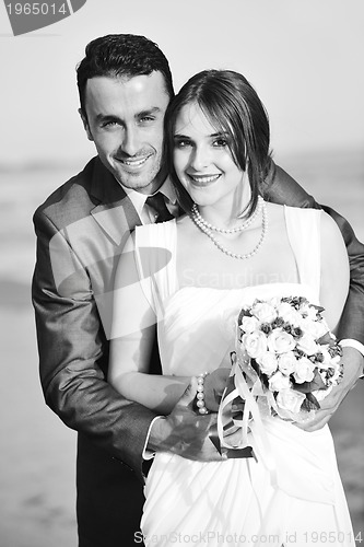 Image of romantic beach wedding at sunset