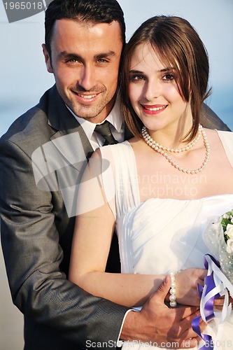 Image of romantic beach wedding at sunset