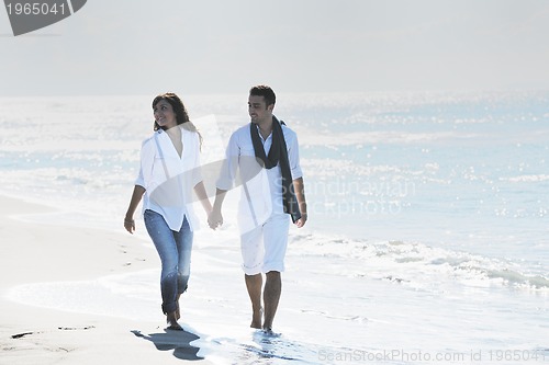 Image of happy young couple have fun at beautiful beach