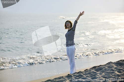 Image of young woman relax  on beach