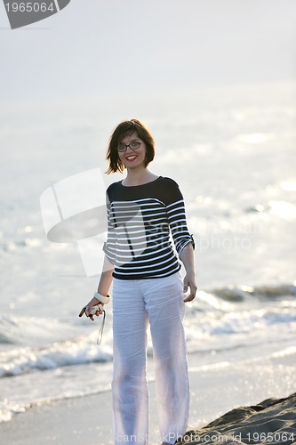 Image of young woman relax  on beach