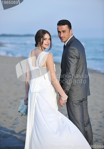 Image of romantic beach wedding at sunset