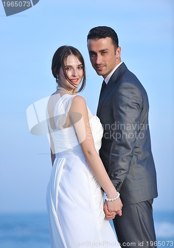 Image of romantic beach wedding at sunset