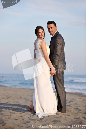 Image of romantic beach wedding at sunset