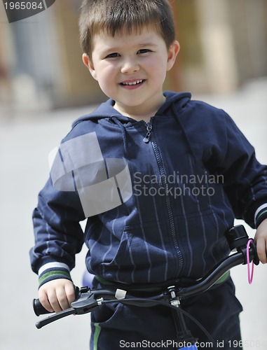 Image of little boy ride bicycle