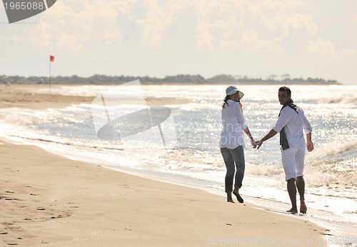 Image of happy young couple have fun at beautiful beach