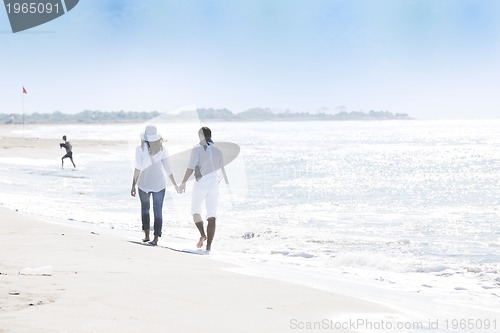 Image of happy young couple have fun at beautiful beach