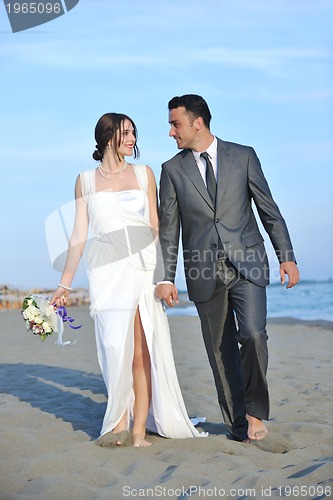 Image of romantic beach wedding at sunset