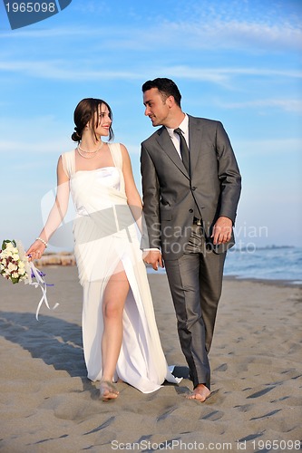 Image of romantic beach wedding at sunset