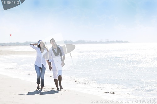 Image of happy young couple have fun at beautiful beach
