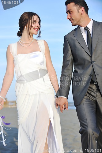 Image of romantic beach wedding at sunset