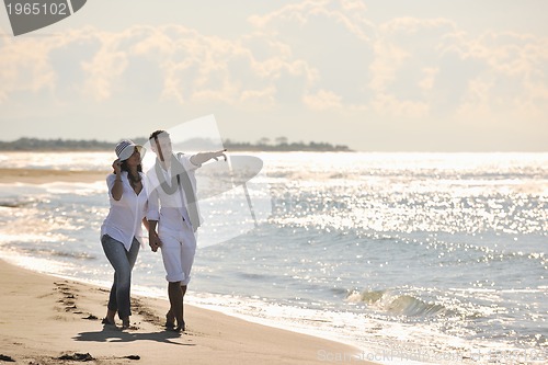 Image of happy young couple have fun at beautiful beach