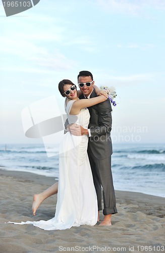 Image of romantic beach wedding at sunset