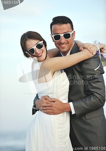 Image of romantic beach wedding at sunset