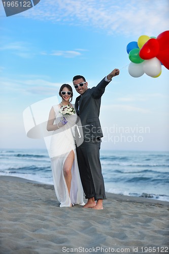 Image of romantic beach wedding at sunset