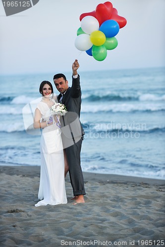 Image of romantic beach wedding at sunset