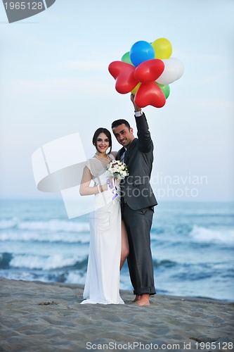 Image of romantic beach wedding at sunset