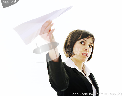 Image of business woman throwing  paper airplane 