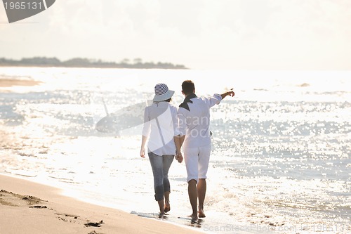 Image of happy young couple have fun at beautiful beach