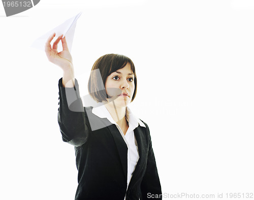 Image of business woman throwing  paper airplane 