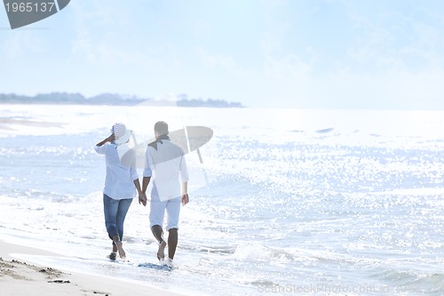 Image of happy young couple have fun at beautiful beach