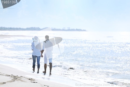 Image of happy young couple have fun at beautiful beach