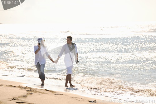 Image of happy young couple have fun at beautiful beach