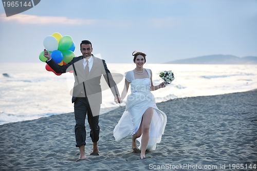 Image of romantic beach wedding at sunset