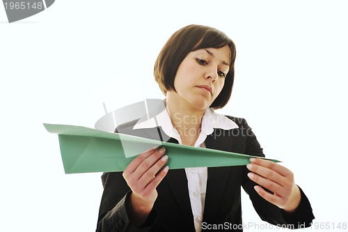 Image of business woman throwing  paper airplane 