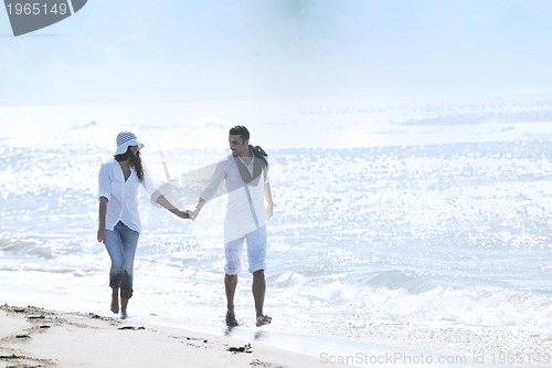 Image of happy young couple have fun at beautiful beach