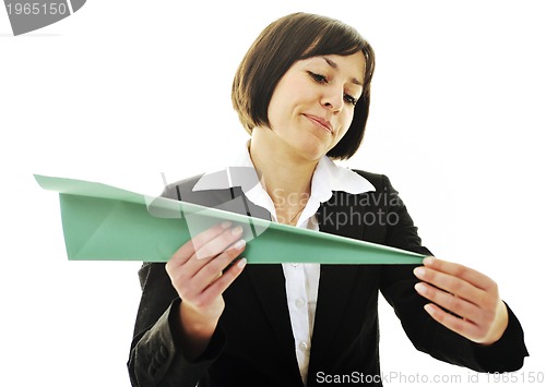 Image of business woman throwing  paper airplane 