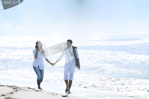 Image of happy young couple have fun at beautiful beach