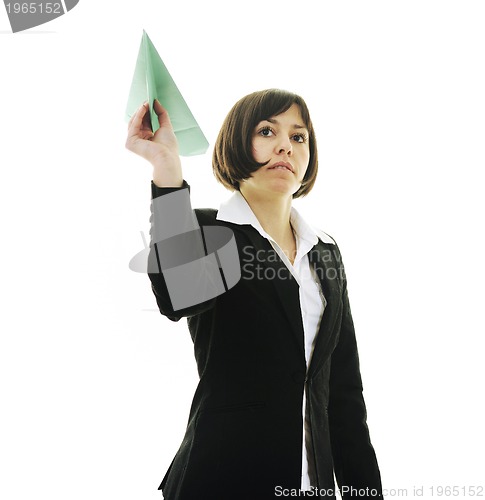 Image of business woman throwing  paper airplane 