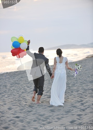 Image of romantic beach wedding at sunset