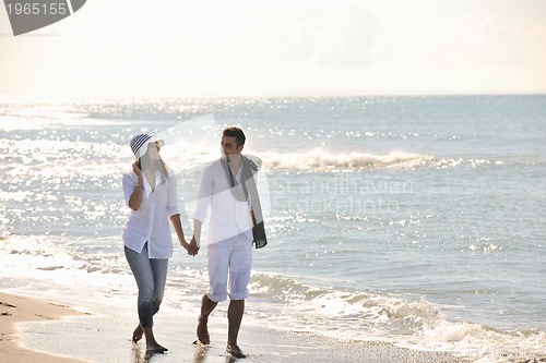 Image of happy young couple have fun at beautiful beach