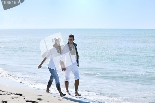 Image of happy young couple have fun at beautiful beach