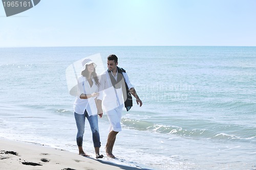 Image of happy young couple have fun at beautiful beach