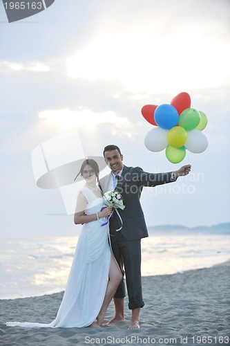 Image of romantic beach wedding at sunset