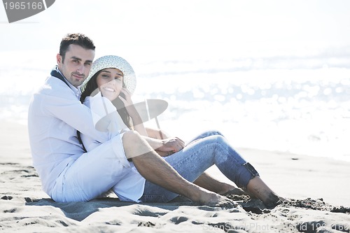 Image of happy young couple have fun at beautiful beach