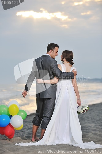 Image of romantic beach wedding at sunset