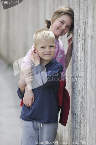 Image of brother and sister outdoor portrait