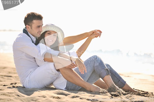 Image of happy young couple have fun at beautiful beach