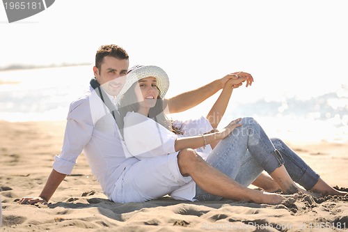 Image of happy young couple have fun at beautiful beach
