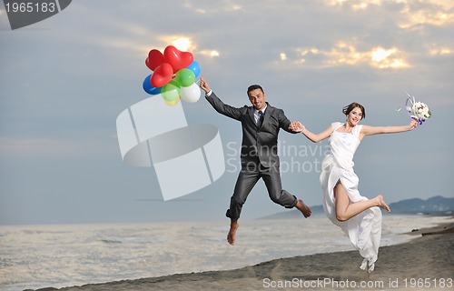 Image of romantic beach wedding at sunset